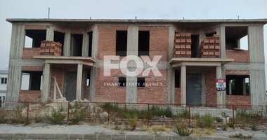 Residential plot with 2 incomplete semi detached houses in Timi, Paphos