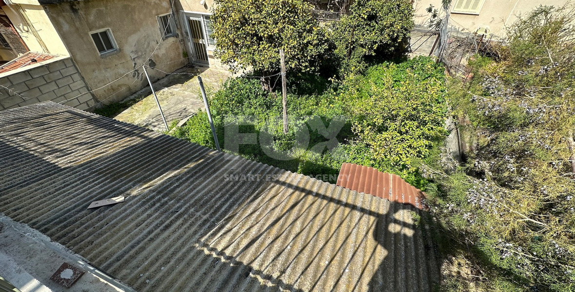 PLOT WITH TWO STOREY BUILDING ON IN THE HEART OF AGIA ZONI