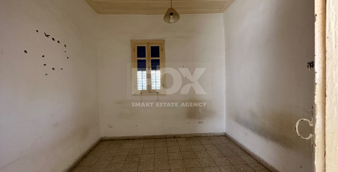 PLOT WITH TWO STOREY BUILDING ON IN THE HEART OF AGIA ZONI