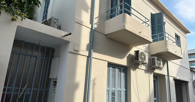 Exclusive Listing, Renovated Building offering ground level and upper level residences with garage in prime location Agia Zoni.
