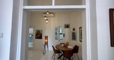 Exclusive Listing, Renovated Building offering ground level and upper level residences with garage in prime location Agia Zoni.