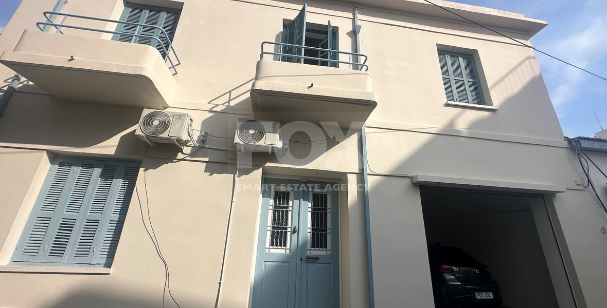 Exclusive Listing, Renovated Building offering ground level and upper level residences with garage in prime location Agia Zoni.