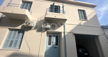 Exclusive Listing, Renovated Building offering ground level and upper level residences with garage in prime location Agia Zoni.