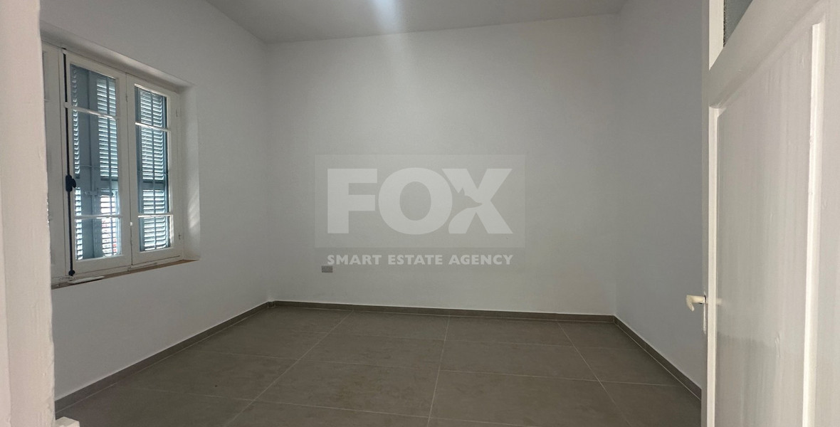 Exclusive Listing, Renovated Building offering ground level and upper level residences with garage in prime location Agia Zoni.