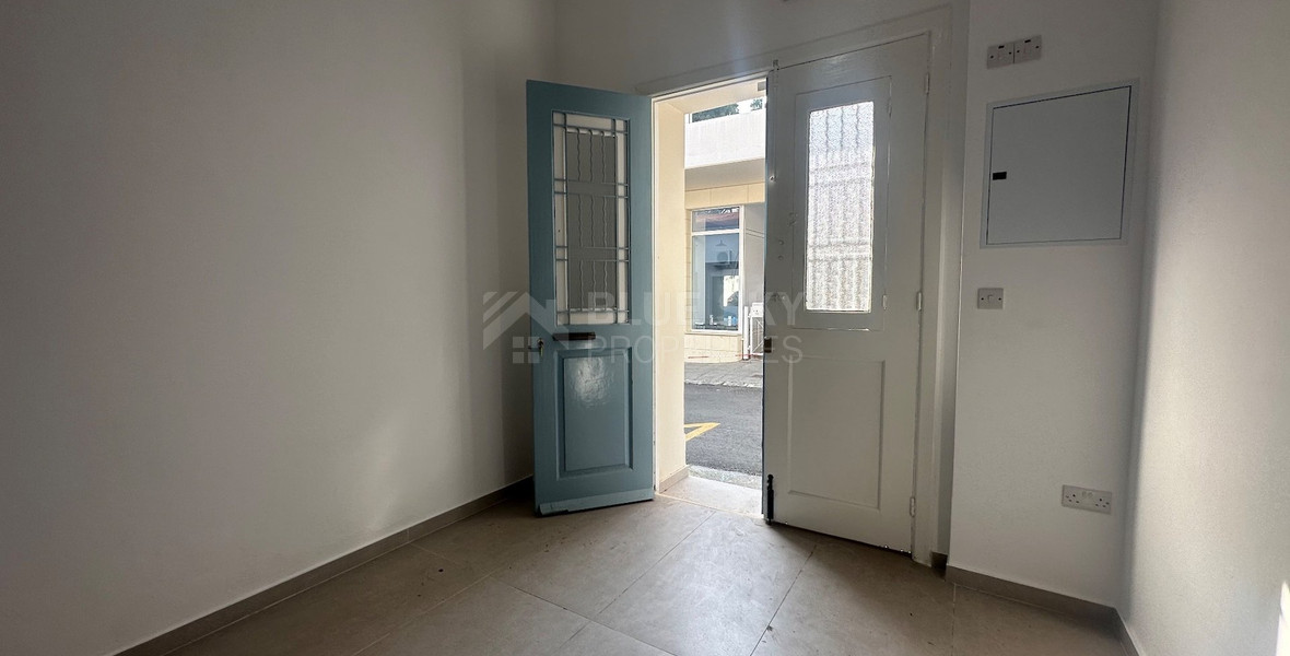 Exclusive Listing, Renovated Building offering ground level and upper level residences with garage in prime location Agia Zoni.