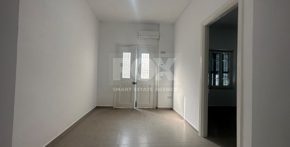 Exclusive Listing, Renovated Building offering ground level and upper level residences with garage in prime location Agia Zoni.