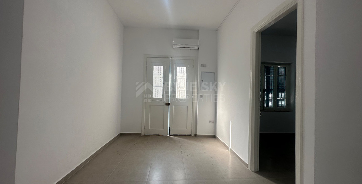 Exclusive Listing, Renovated Building offering ground level and upper level residences with garage in prime location Agia Zoni.