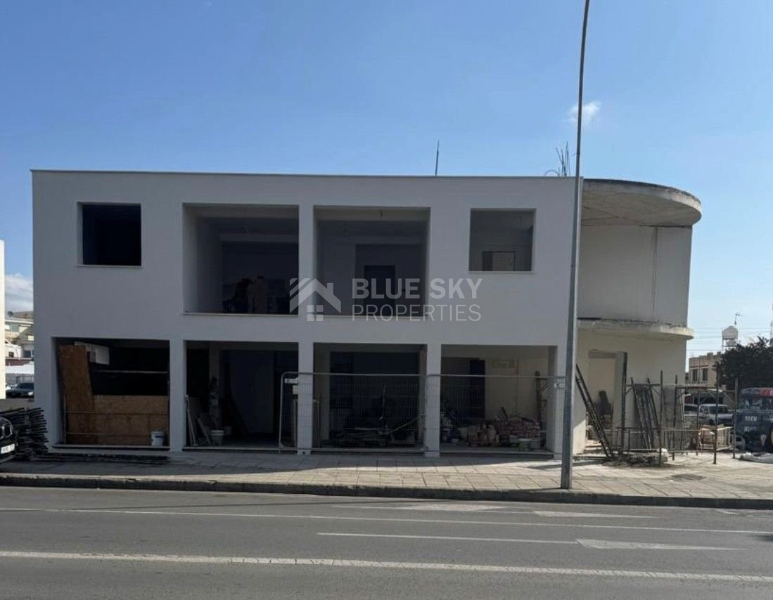 For sale: A fully renovated building on a prime commercial Avenue offering shops on the ground level and apartments on the upper level