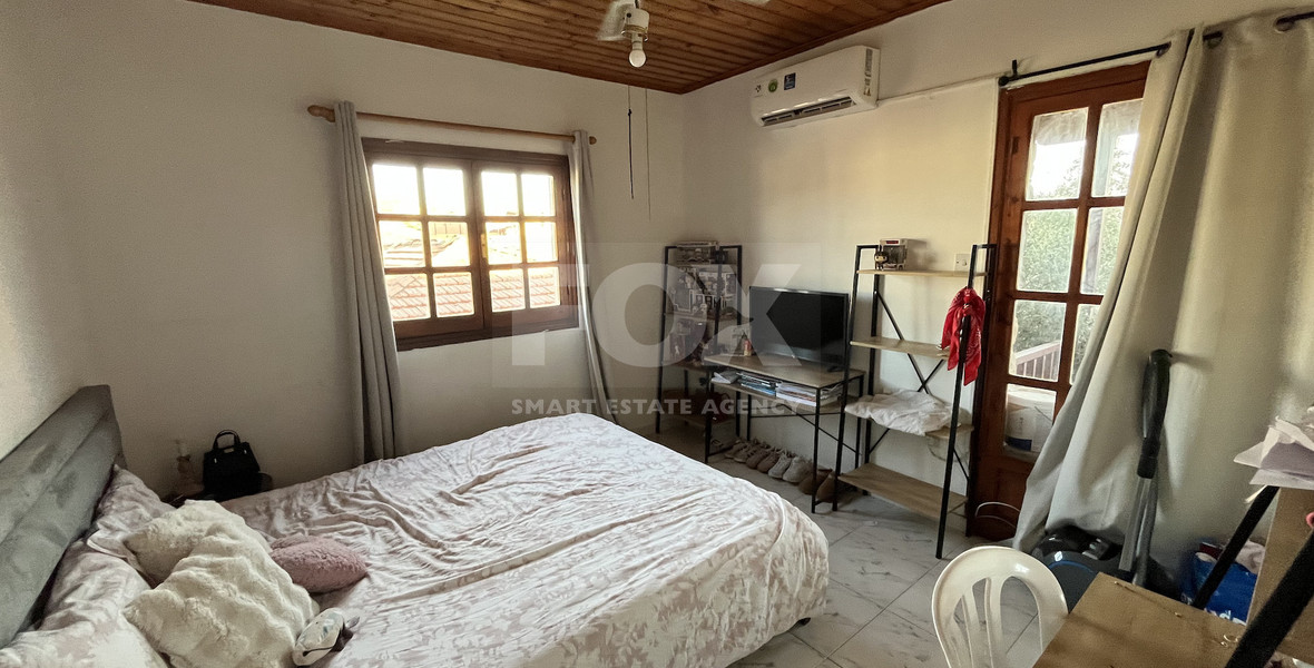 For Sale Two-Story Stone House with Yard at the Heart of Parekklisia