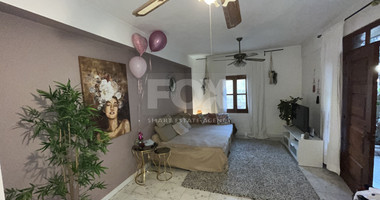 For Sale Two-Story Stone House with Yard at the Heart of Parekklisia