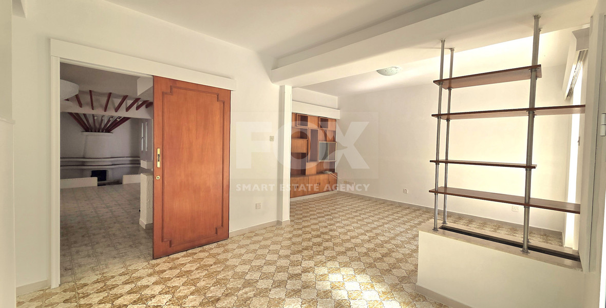 Spacious  four bedroom apartment with  fireplace charm and two large verandas for rent in Katholiki Limassol