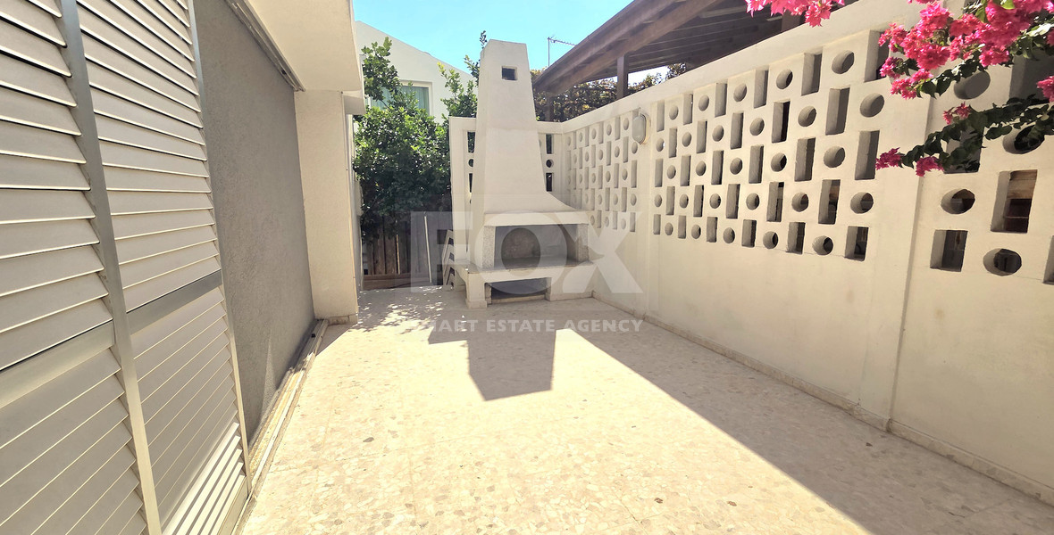 Spacious  four bedroom apartment with  fireplace charm and two large verandas for rent in Katholiki Limassol