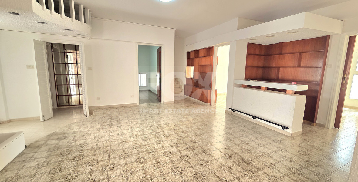 Spacious  four bedroom apartment with  fireplace charm and two large verandas for rent in Katholiki Limassol