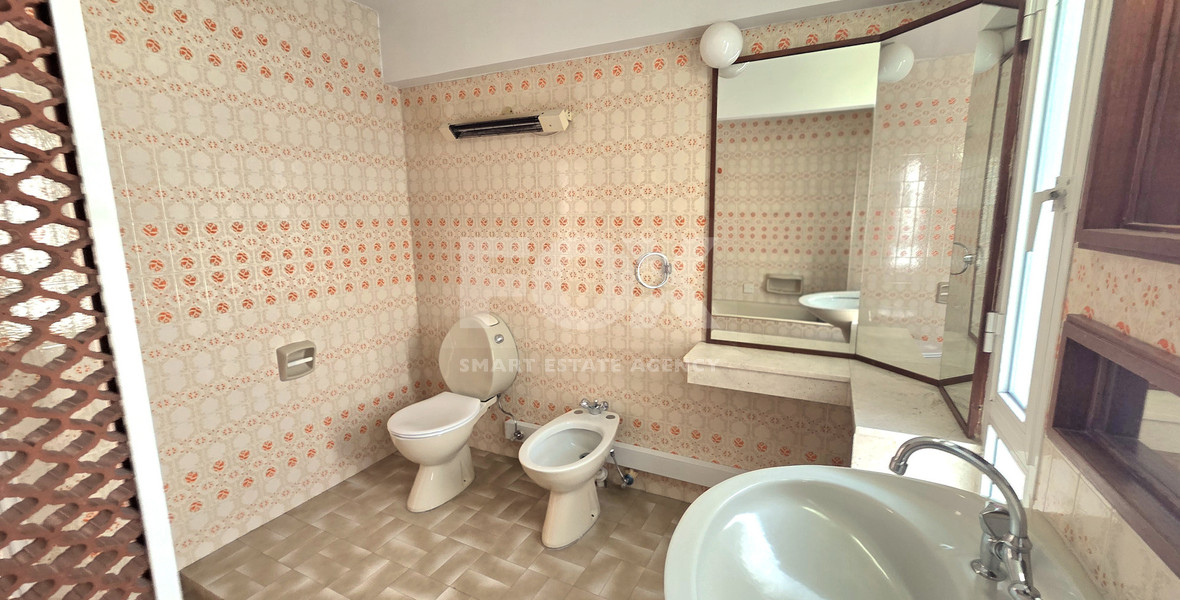 Spacious  four bedroom apartment with  fireplace charm and two large verandas for rent in Katholiki Limassol