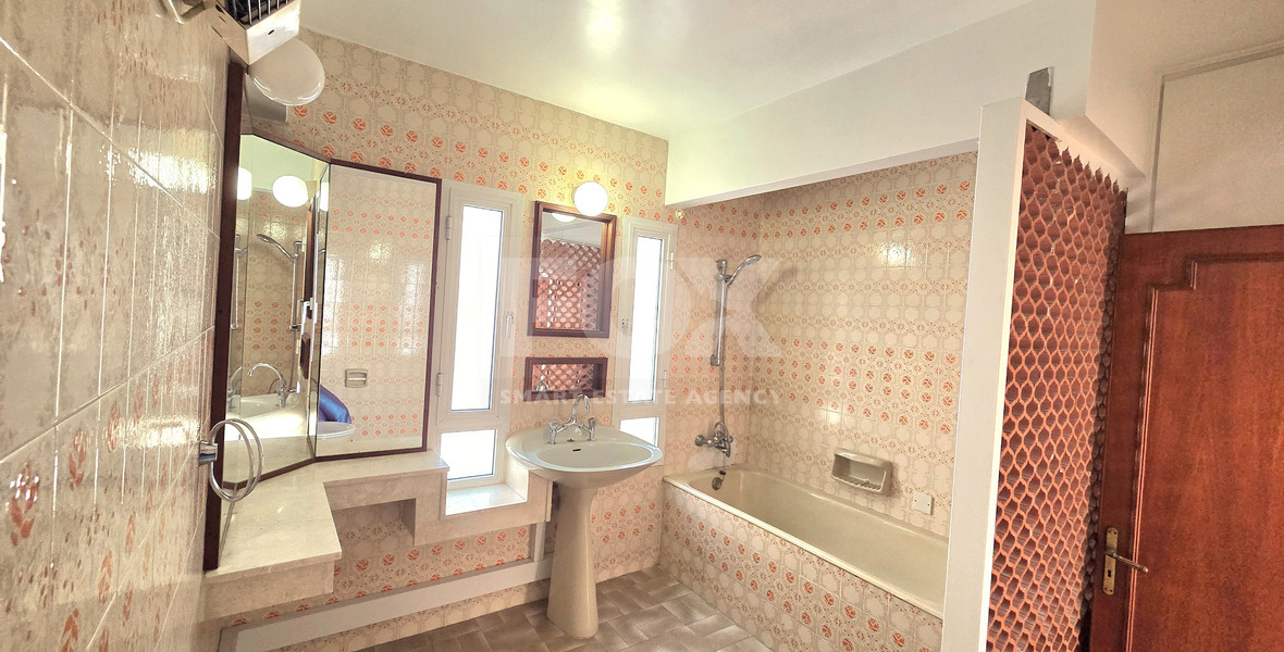 Spacious  four bedroom apartment with  fireplace charm and two large verandas for rent in Katholiki Limassol