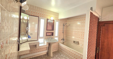 Spacious  four bedroom apartment with  fireplace charm and two large verandas for rent in Katholiki Limassol