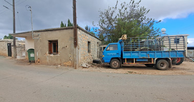 Land for sale with an old derelict house in Droushia, Paphos.