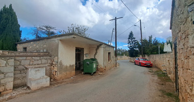 Land for sale with an old derelict house in Droushia, Paphos.