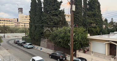 FOR SALE UPPER LEVEL THREE BEDROOM APARTMENT  WITH GARAGE, IN OMONOIA AVENUE OPPOSITE GREEN AREA