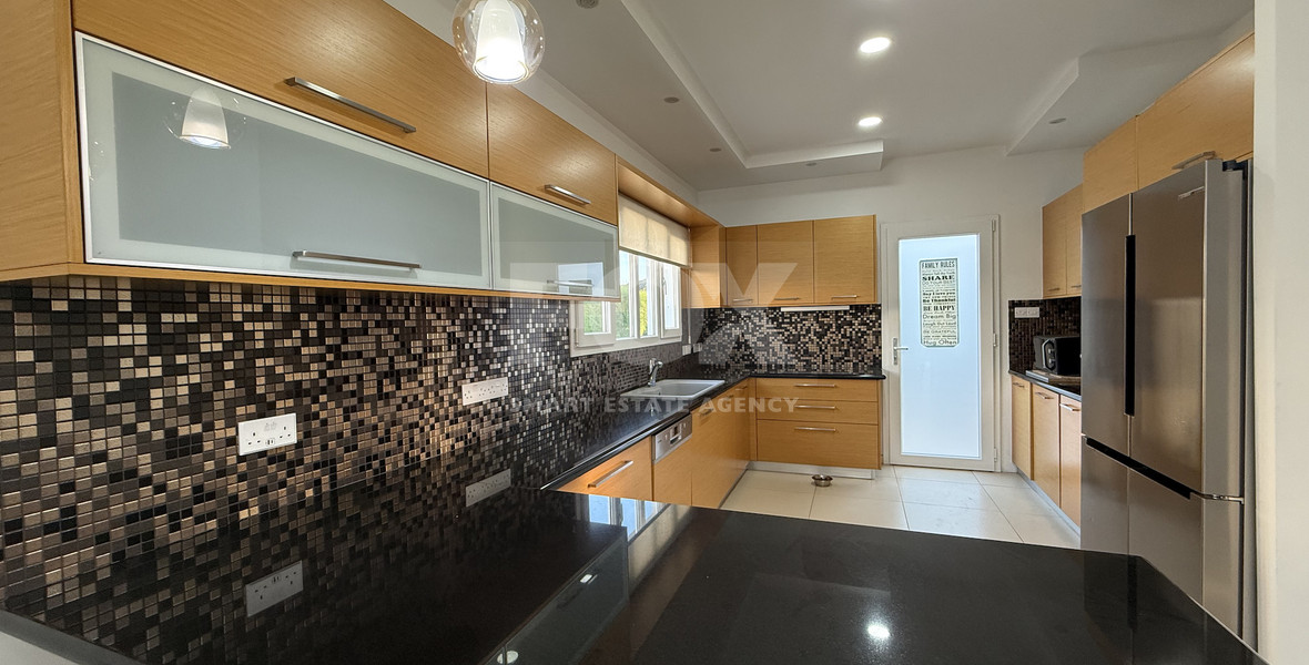 FOR RENT FURNISHED FIVE BEDROOM VILLA IN AGIOS TYCHONAS WITH ALL EN SUITE BEDROOMS , LARGE GARDEN, SWIMMING POOL