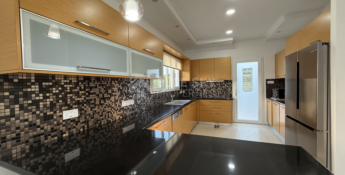 FOR RENT FURNISHED FIVE BEDROOM VILLA IN AGIOS TYCHONAS WITH ALL EN SUITE BEDROOMS , LARGE GARDEN, SWIMMING POOL