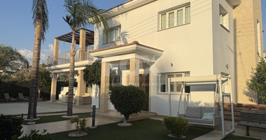 FOR RENT FURNISHED FIVE BEDROOM VILLA IN AGIOS TYCHONAS WITH ALL EN SUITE BEDROOMS , LARGE GARDEN, SWIMMING POOL