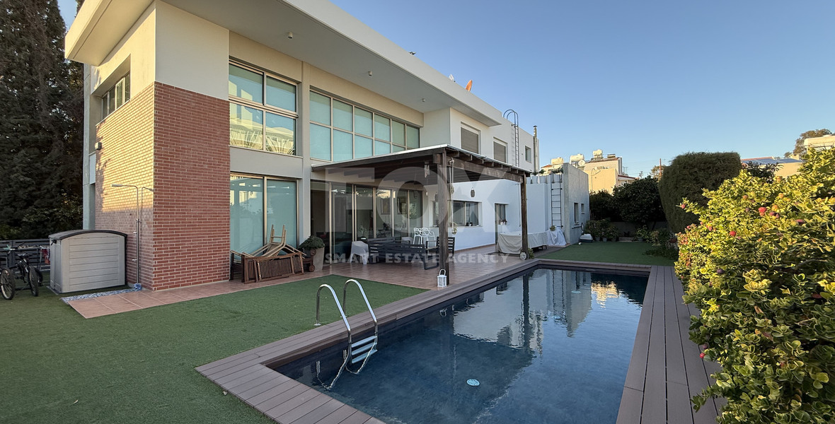 For Sale Elegant four-Bedroom Bespoke Residence in Agios Athanasios below the highway within walking distance to all amenities.