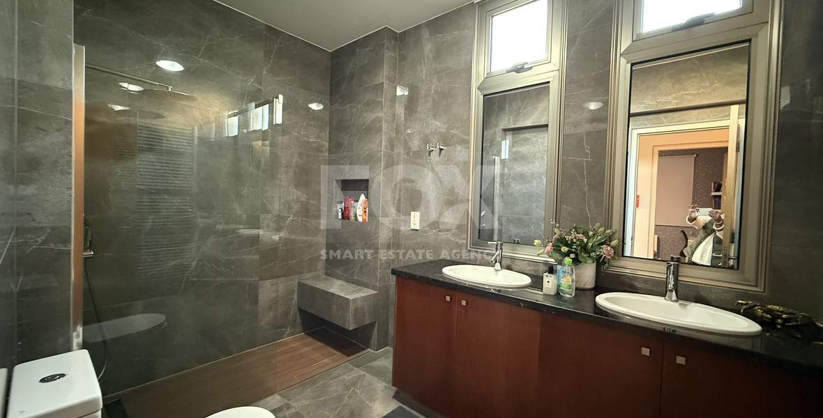 For Sale Elegant four-Bedroom Bespoke Residence in Agios Athanasios below the highway within walking distance to all amenities.