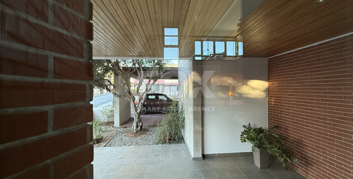 For Sale Elegant four-Bedroom Bespoke Residence in Agios Athanasios below the highway within walking distance to all amenities.