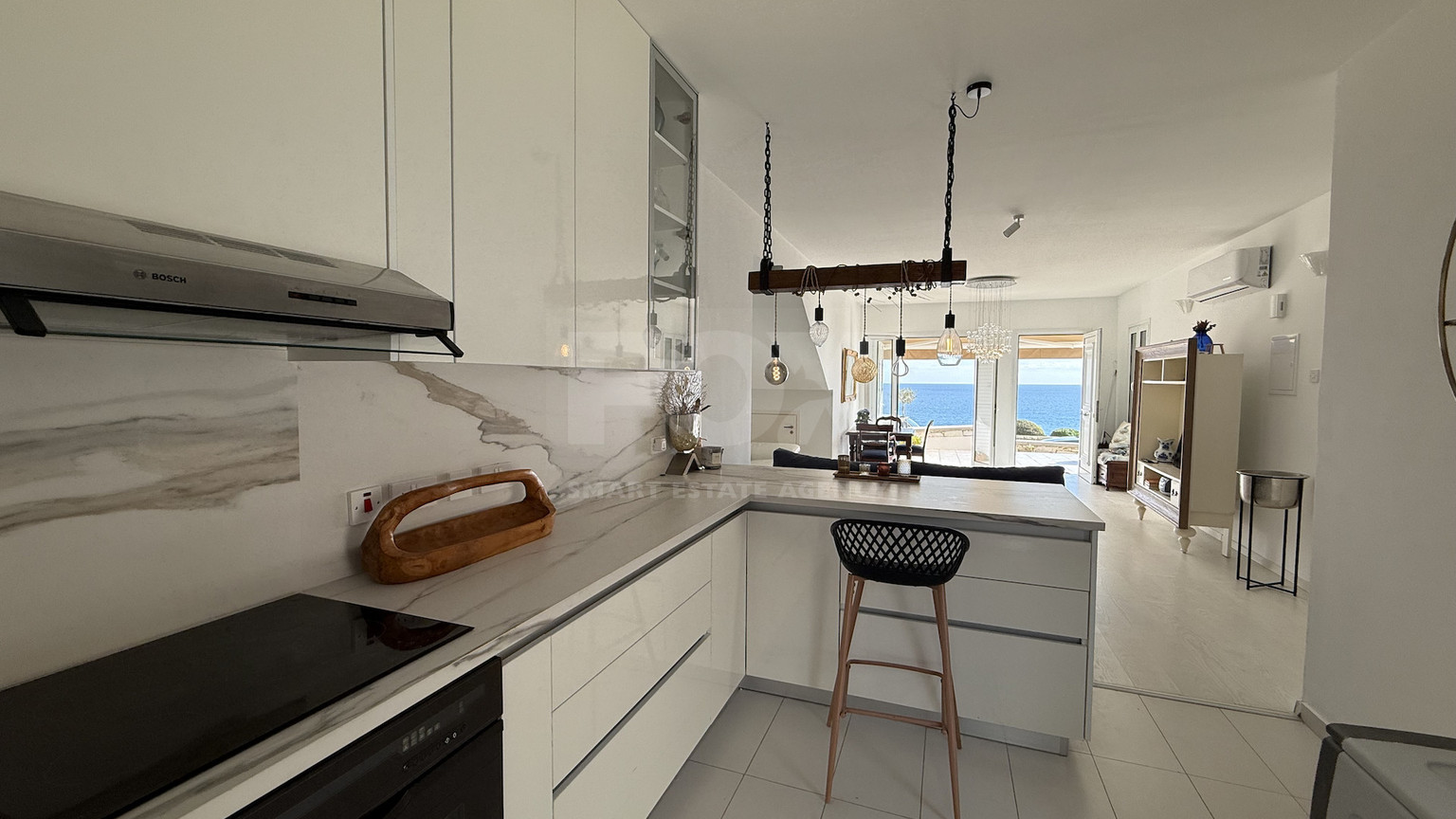 Rent: Renovated, fully furnished two bedroom ground floor apartment in the Amathusia area of Limassol, offering panoramic sea views.