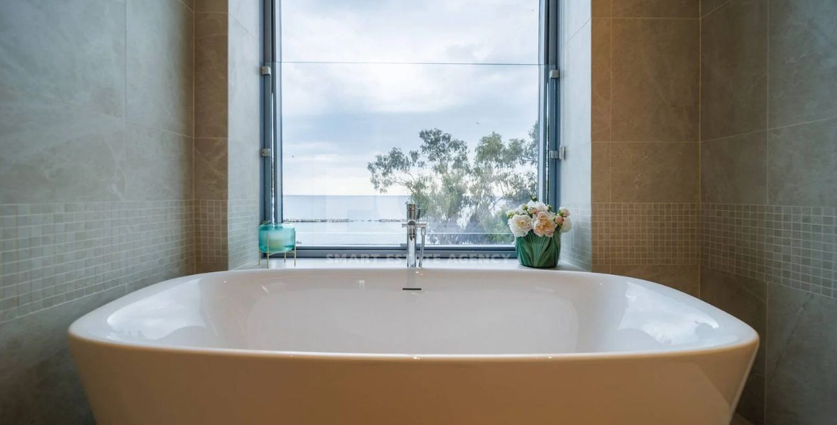 Exclusive Beachfront Living in Agios Tychonas – Four-Bedroom Full-Floor Apartment