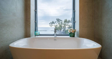 Exclusive Beachfront Living in Agios Tychonas – Four-Bedroom Full-Floor Apartment