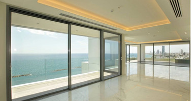 Exclusive Beachfront Living in Agios Tychonas – Four-Bedroom Full-Floor Apartment