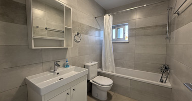 RENT:LARGE BRIGHT ONE BEDROOM GROUND FLOOR APARTMENT IN GERMASOGIA ON ON LARGE PLOT.