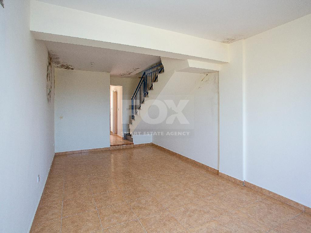 A two-bedroom house for sale in Argaka, Paphos, offering verandas, rooftop terrace, and excellent potential for permanent living, holidays, or rental investment.