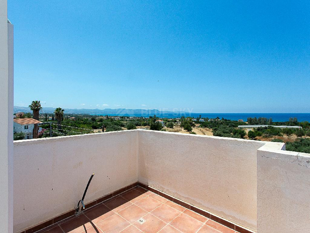 A two-bedroom house for sale in Argaka, Paphos, offering verandas, rooftop terrace, and excellent potential for permanent living, holidays, or rental investment.