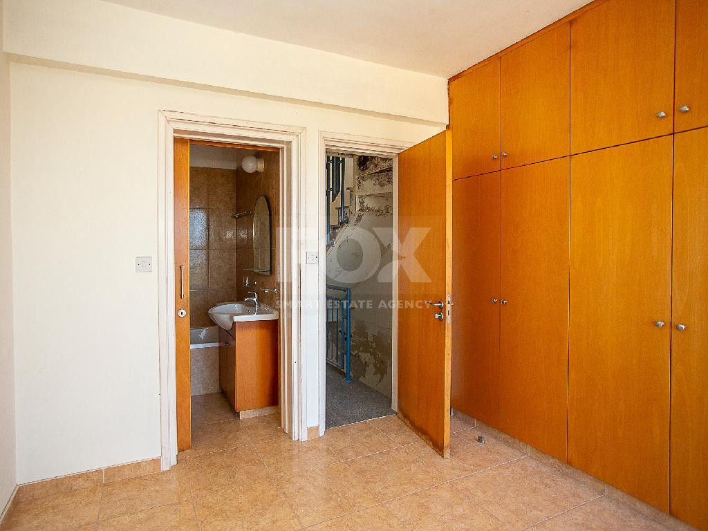A two-bedroom house for sale in Argaka, Paphos with verandas, rooftop terrace, and excellent potential for permanent living, holidays, or rental investment.