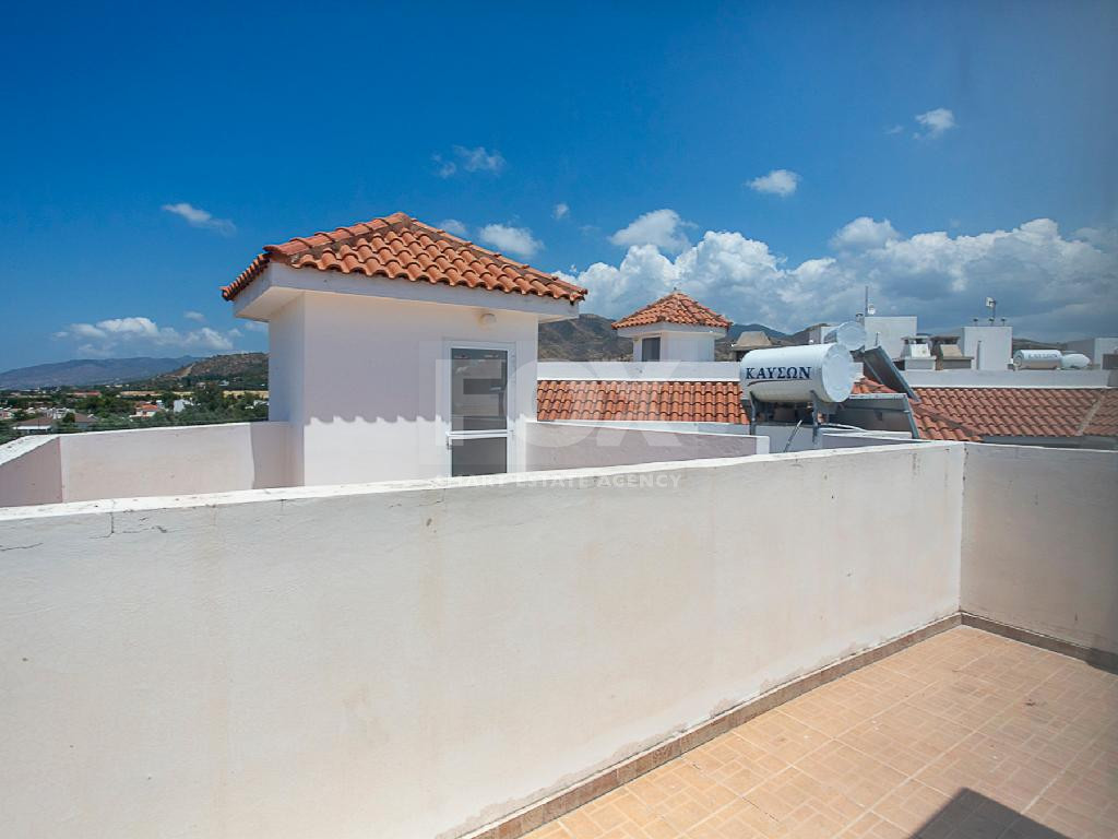 A two-bedroom house for sale in Argaka, Paphos with verandas, rooftop terrace, and excellent potential for permanent living, holidays, or rental investment.