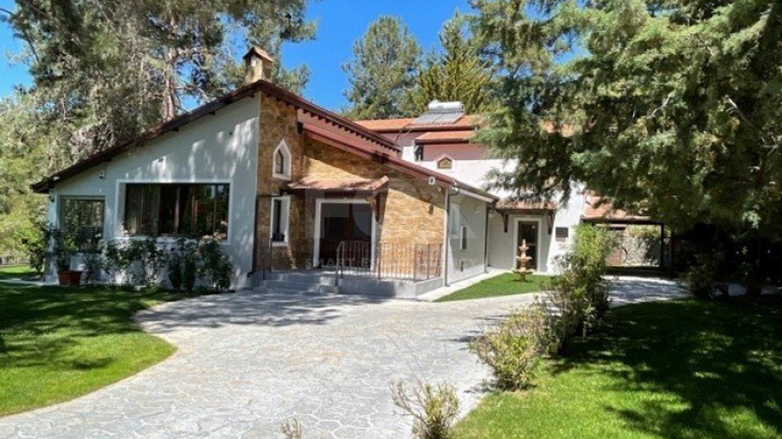 Luxury Viila with guest house in Moniatis with its own private grounds of landscaped gardens engulfed by forest trees.