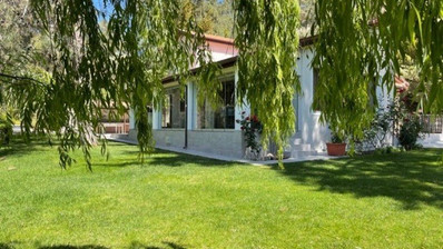 Luxury Viila with guest house in Moniatis with its own private grounds of landscaped gardens engulfed by forest trees.